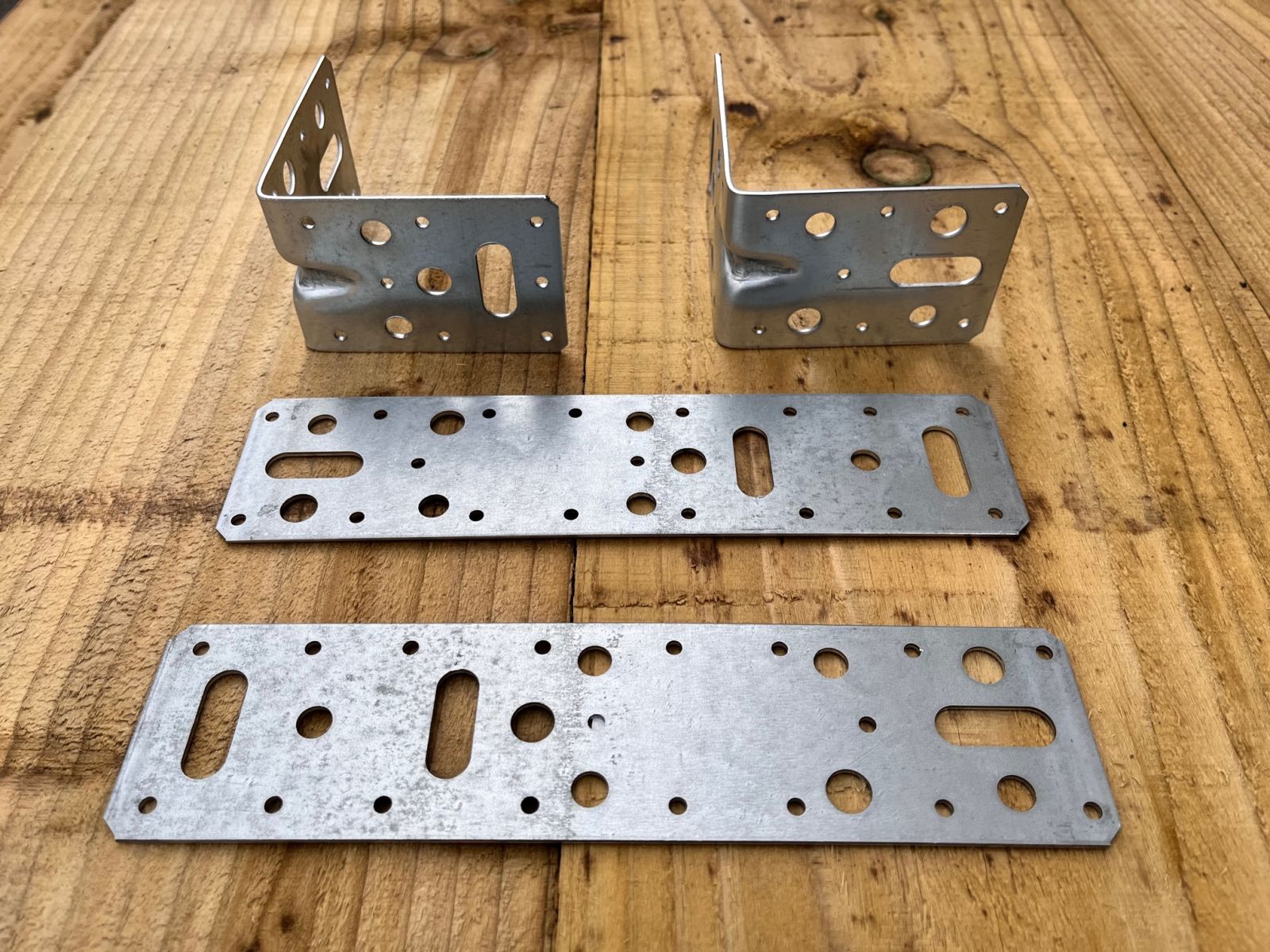 Steel angle brackets and flat connector plates for connecting railway sleepers together. Railwaysleepers.com