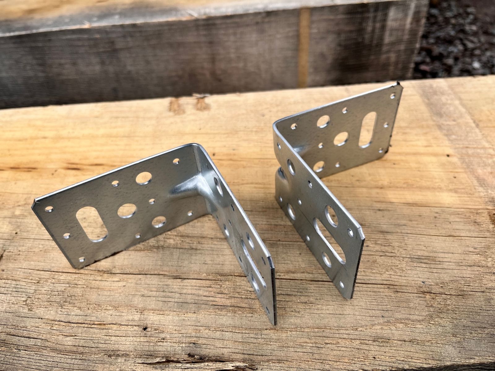 Steel angle brackets used to connect railway sleepers together at 90 degree corners