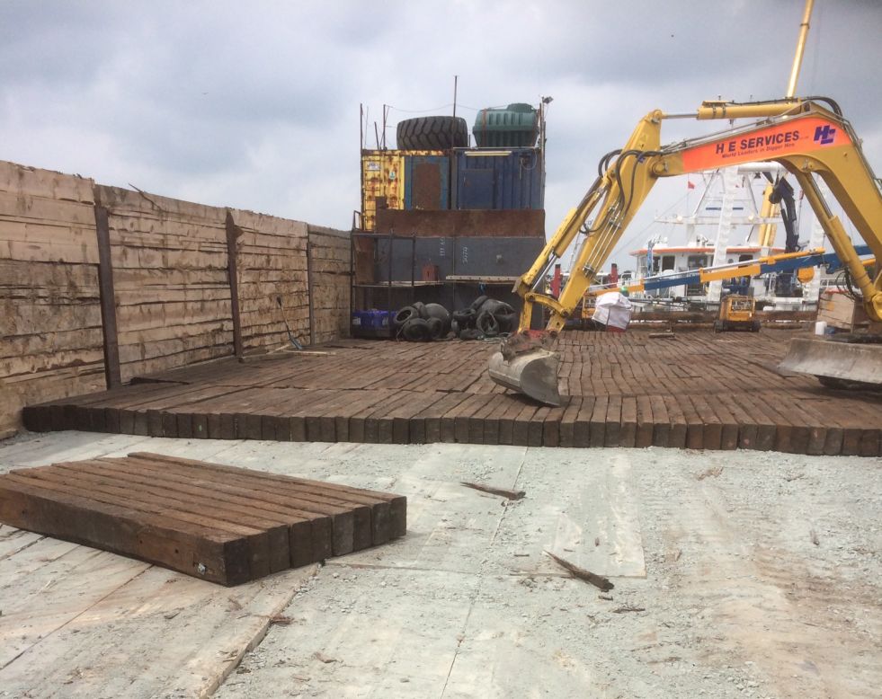 Thousands of used railway sleepers used for the deck of a barge. Railwaysleepers.com
