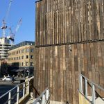ICONIC CAMDEN ROUNDHOUSE THEATRE CLAD WITH RECLAIMED TROPICAL HARDWOOD RAILWAY SLEEPERS