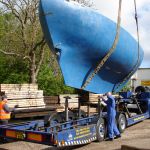 The moving of a concrete boat from the railway sleeper yard