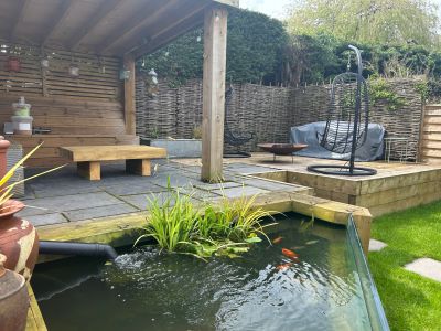 ADRIAN'S BEAUTIFUL PATIO, POND AND TABLE WITH NEW PINE RAILWAY SLEEPERS.