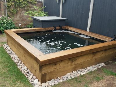 STEVE BUILDS A RAISED FISH POND WITH NEW PINE RAILWAY SLEEPERS