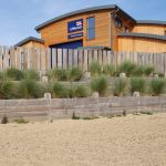 RAILWAY SLEEPER WALLS SURROUND THE NEW LIFEBOAT STATION AT WELLS-NEXT-THE-SEA