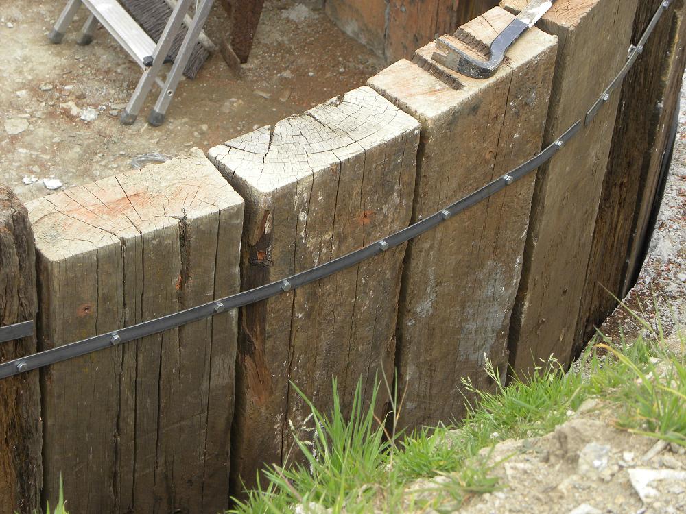 Retaining wall built from vertical used tropical hardwood railway sleepers. Railwaysleepers.com 